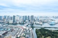 Panoramic modern city skyline bird eye aerial view of Odaiba bay and bridge under dramatic sunrise and morning blue cloudy sky in