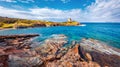 Panoramic morning view of Piscinni bay with Torre di Pixinni tower on background. Splendid summer scene of Sardinia island, Italy.