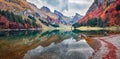 Panoramic morning view of Seealpsee lake. Colorful autumn scene of Swiss Alps. Majestic Santis peak reflected in the calm surface Royalty Free Stock Photo