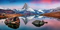 Panoramic morning view of Stellisee lake with Matterhorn / Cervino peak on background. Impressive autumn scene of Swiss Alps, Zerm