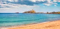 Panoramic morning view of Torre del Coltellazzo o di Sant`Efisio tower. Colorful summer scene of Sardinia island, Italy, Europe.
