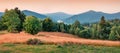 Panoramic morning view of the valley of Lacul Dragan lake, Cluj County, Romania. Stunning summer sunrise on Apuseni Mountains. Bea Royalty Free Stock Photo