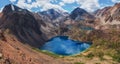 Panoramic mountain lake in the shape of a heart. Atmospheric green landscape with lake in high mountain green valley. Great Royalty Free Stock Photo