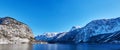 Panoramic mountain landscape of Hallstatt lake at sunny day in Austrian Alps, Salzkammergut region Royalty Free Stock Photo