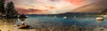 Panoramic mountain landscape scene in Lake Tahoe California with a colorful sunset in the background Royalty Free Stock Photo