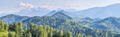 Panoramic mountain view. Spring greens of forests Royalty Free Stock Photo