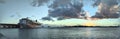 Panoramic of NCL Pride of America Cruise ship docked in Honolulu Harbor at Sunset Royalty Free Stock Photo