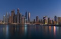 Panoramic night view of Dubai Marina skyscrapers and reflections Royalty Free Stock Photo