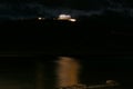 Panoramic night view of the remains of a Greek temple dedicated to Poseidon, on the cape of Cape Sunio, located on the southern