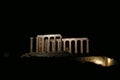 Panoramic night view of the remains of a Greek temple dedicated to Poseidon, on the cape of Cape Sunio, located on the southern