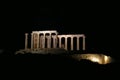 Panoramic night view of the remains of a Greek temple dedicated to Poseidon, on the cape of Cape Sunio, located on the southern