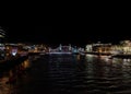 Panoramic night view of the River Thames with the illuminated Tower Bridge and the museum ship HMS Belfast docked in the river Royalty Free Stock Photo