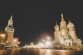 Panoramic night view of Spasskaya Tower of the Kremlin and St\' Basil Cathedral in Red Square, Moscow, Russian Federation. Red Royalty Free Stock Photo