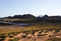 Panoramic ocean view. Volcano, black rocks. Sand macro. Sea background. Horizon.