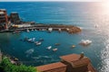 Panoramic overview of Vernazza village with colorful houses on bright summer sunny day, Cinque Terre National Park, La Spezia Royalty Free Stock Photo