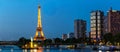 Panoramic Paris cityscape with Eiffel tower, quay de Grenelle at night, Paris, France.