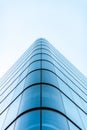 Panoramic and perspective wide angle view to steel light blue background of glass high rise building skyscraper commercial modern Royalty Free Stock Photo