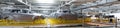 Panoramic photo of car bodies are on assembly line. Factory for production of cars. Modern automotive industry