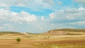 Panoramic photo of majestic cloudscape over dry autumnal agricultural land. Teruel, Aragon, Spain. Soft tone, vivid cyan colour