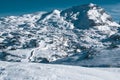 panoramic photo of the snow-capped Soum Couy mountain in winter and below the ski slopes of Arette Royalty Free Stock Photo