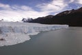 Panoramic photo of tourists on the observation deck looking at Perito Moreno Glacier. Argentina, Los Glaciares National Park Royalty Free Stock Photo