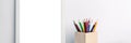 Panoramic photo of a white mockup frame with colorful pencils Royalty Free Stock Photo