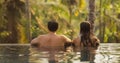 Couple in Love Together in Infinity Swimming Pool Outdoors During Tropical Vacation Royalty Free Stock Photo