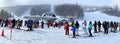 Panoramic picture of people at lift line at Okemo mountain ski resort