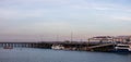 Panoramic picture of a pier and the Wharf in the city of Darwin, Northern Territory, Australia. Boats and beach near the city.