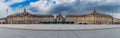 Panoramic of the Place de la Bourse and a passing tram, in Bordeaux in Gironde, Nouvelle Aquitaine, France Royalty Free Stock Photo