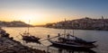 Panoramic of Porto cityscape in sunset with river on the front and wine carrier ship in  foreground and city of Porto in Royalty Free Stock Photo