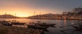 Panoramic of Porto cityscape in sunset with river on the front and wine carrier ship in  foreground and city of Porto in Royalty Free Stock Photo