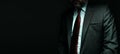 Panoramic portrait of senior executive businessman over dark background, low key image Royalty Free Stock Photo