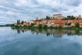 Panoramic of Ptuj city with the Drava river in front of the picture with its reflection in Slovenia. Royalty Free Stock Photo