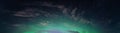 Panoramic real photo of beautiful soft Aurora Borealis - bright green lights on black night sky with some clouds. A lot of real Royalty Free Stock Photo