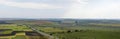 Panoramic road through agricultural fields Royalty Free Stock Photo