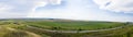 Panoramic road through the fields Royalty Free Stock Photo