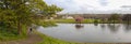 Panoramic romantic view, walking couple at Inverleith Park, Edinburgh, Scotland