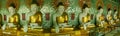 Panoramic of row of golden Buddhas in Mandalay temple, Myanmar Royalty Free Stock Photo