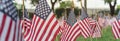 Panoramic row of lawn American flags display on green grass on Memorial Day in Dallas, Texas, USA Royalty Free Stock Photo