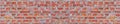 Panoramic rugged old red brown bricks wall texture. vintage retro industrial banner background. Royalty Free Stock Photo