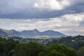 Panoramic rural landscape of hills with the Maritime Alps mountains in the distance near the village Saint-Paul-de-Vence, France Royalty Free Stock Photo