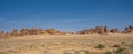 Panoramic of the sandstone mountains in the ancient Al-Ula, Saudi Arabia, against the blue sky Royalty Free Stock Photo