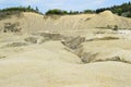 Panoramic scenic landscape of mud volcano at Paclele Mari, Romania, deserted valley on foreground in front of volcano