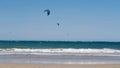 Panoramic sea view with kitesurfing sails. people enjoy riding a kitesurfing board on a bright sunny day, by the sea or Royalty Free Stock Photo