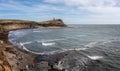 Panoramic seascape of Kimmeridge Bay with Clavell Tower on the top of Hen Cliff at Kimmeridge Bay, Isle of Purbeck, Dorset, UK