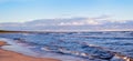 Virgin panoramic seascape with clouds and small waves in Baltic sea