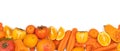 Panoramic set of ripe, juicy orange color fruits and vegetables on white background with copy space. Carrot, orange, persimmon Royalty Free Stock Photo