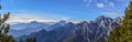 Panoramic shot of a beautiful landscape of snowy mountains on a sunny day Royalty Free Stock Photo