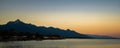 Panoramic shot of buildings near the sea with mountains in the background in Atlantida Honduras